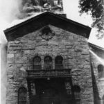 Belltower of Turner Hall engulfed in flames and smoke